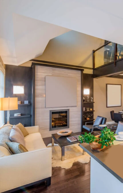 true form construction contemporary living room with a fireplace and tv creating a cozy and stylish ambiance