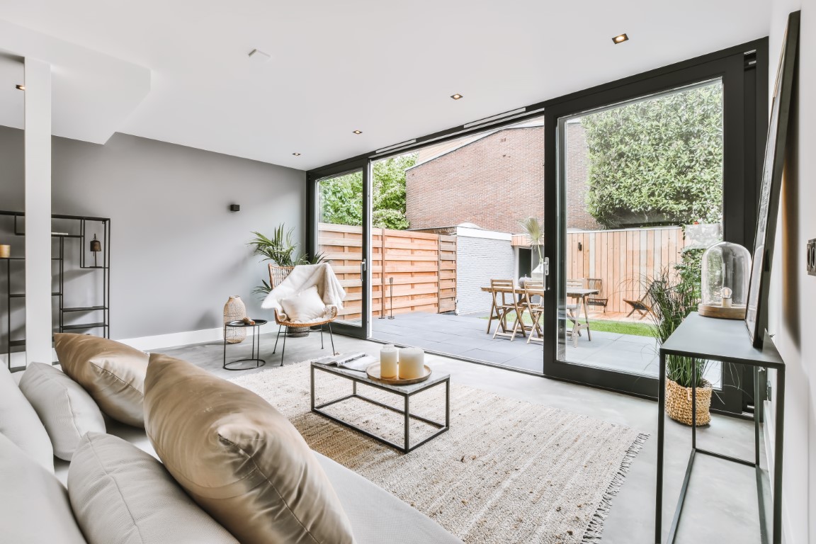 Stylish living area with beige sofa