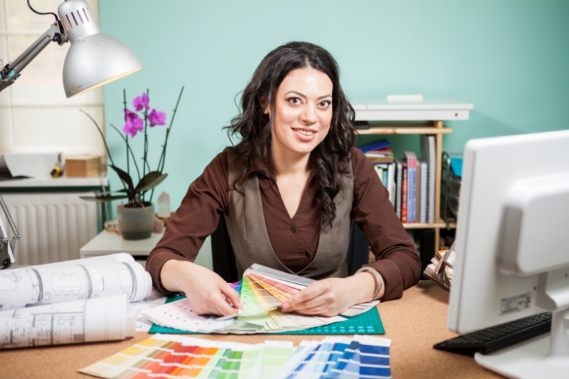 Architect with color palette on desk